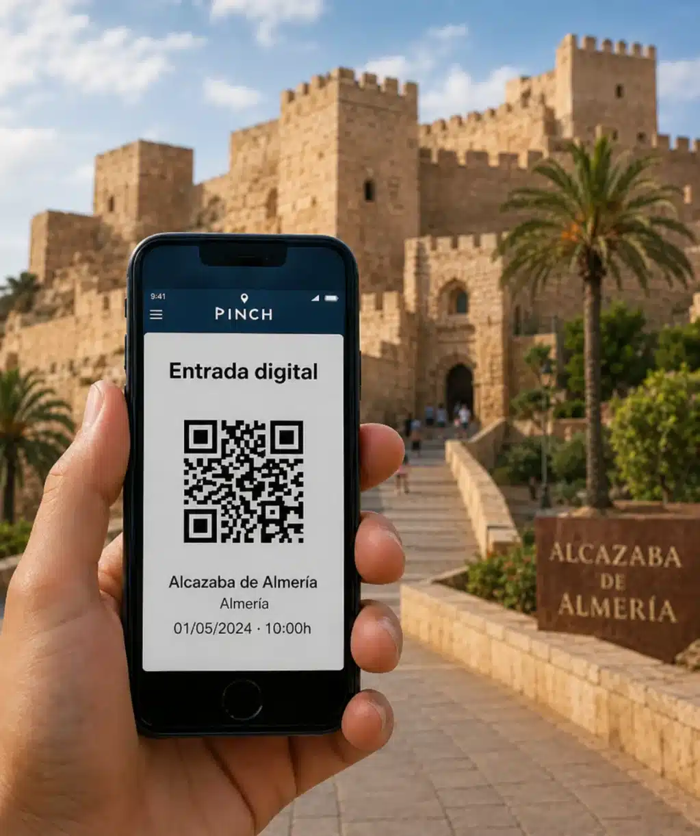 Entrada digital para actividades en Almería mostrada en un teléfono móvil con la Alcazaba de fondo